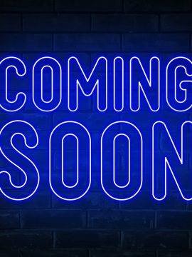 Coming soon - blue neon light word on brick wall background